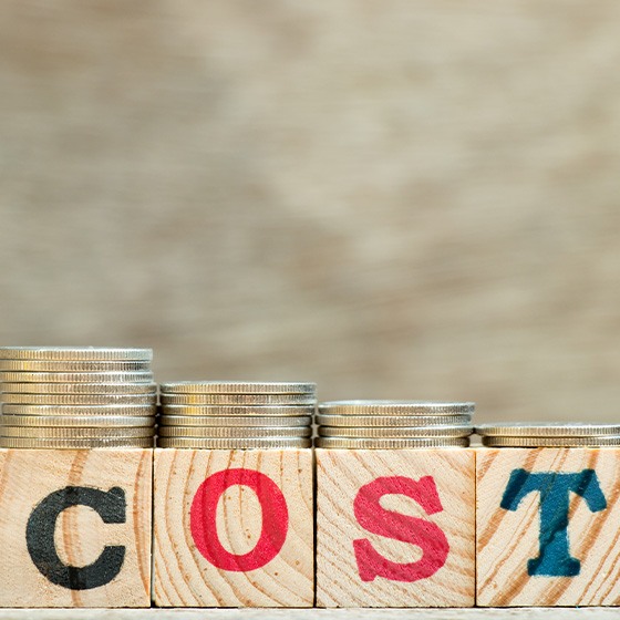 Cost spelled with wooden blocks