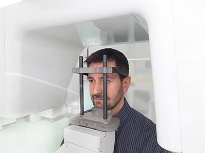 Dental patient in CBCT machine ready for scan