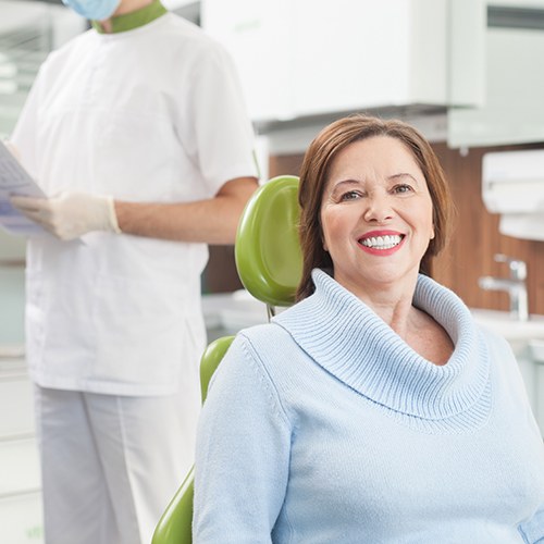 Woman in sweater visiting her prosthodontist