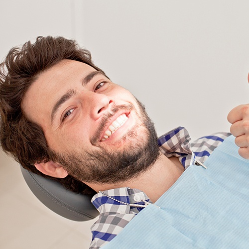 Bearded male patient giving a thumbs up