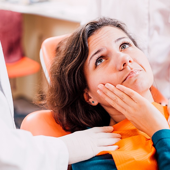 Woman with a painful tooth at the dentist