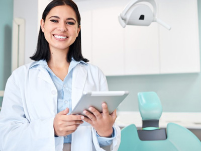 Dentist smiles at viewer